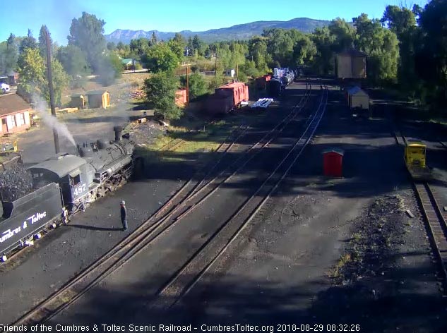 8-08-29 As one hostler looks on the other uses the loader to add coal to the bunker of 487.jpg