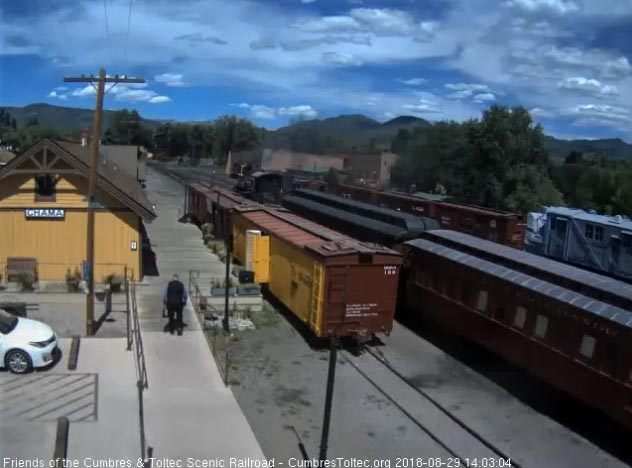 8-08-29 The 2 display cars are parked on the main in front of the depot as 489 is switching cars in the background.jpg