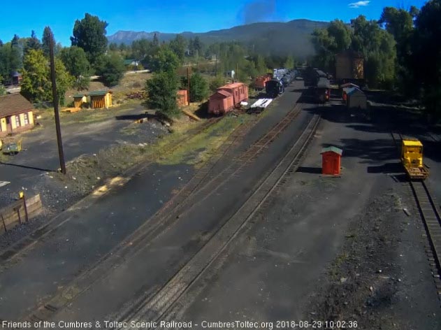 8-08-29 The parlor Colorado passes the tank as the 487 is clearing the yard.jpg