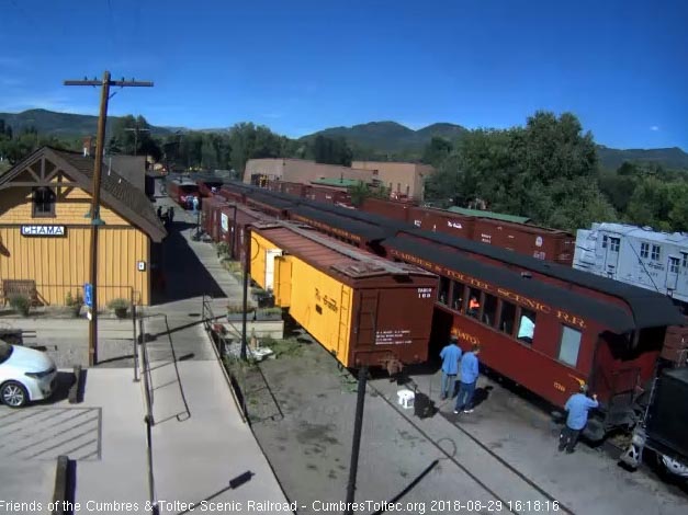 8-08-29 The train is stopped as one of the clearers opens the gate on the first car.jpg