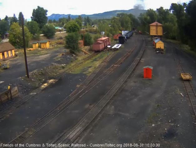 2018-08-31 The last cars are entering the curve as the train heads east.jpg