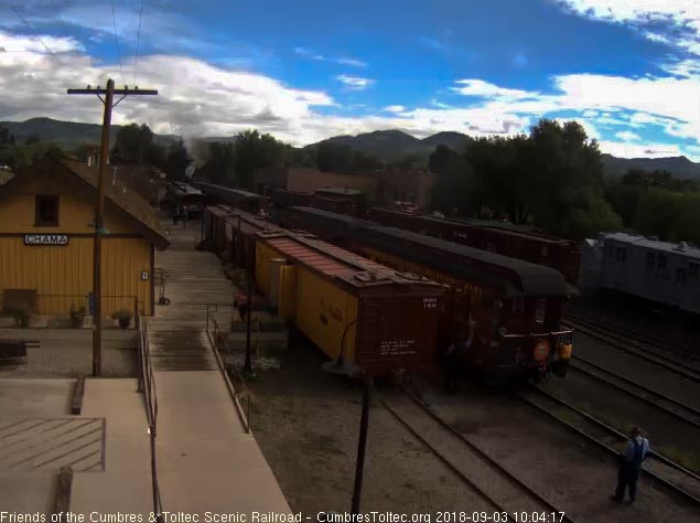 2018-09-03 The conductor of 216 gives the high ball as the conductor of the freight looks on.jpg