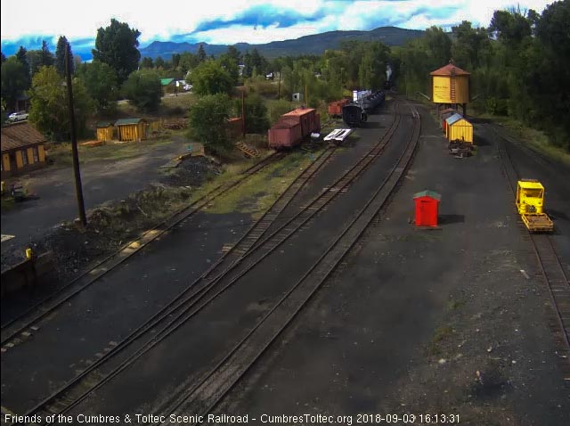 2018-09-03 The 487 comes around the curve into Chama and we see the steam plume from the whistle.jpg