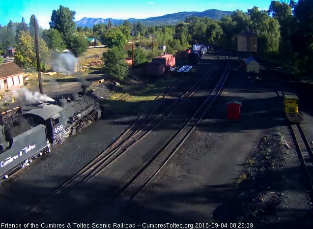 2018-09-04 The coal dust billows as the loader dumps a bucket of coal into the bunker of 489.jpg