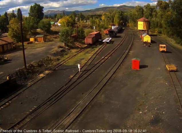 2018-09-16 The headlight of 484 shines out of the shadow as it comes into Chama.jpg