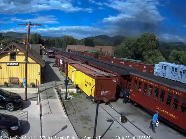 2018-09-16 The train is stopped as the conductor works on getting the gate open on the first car.jpg