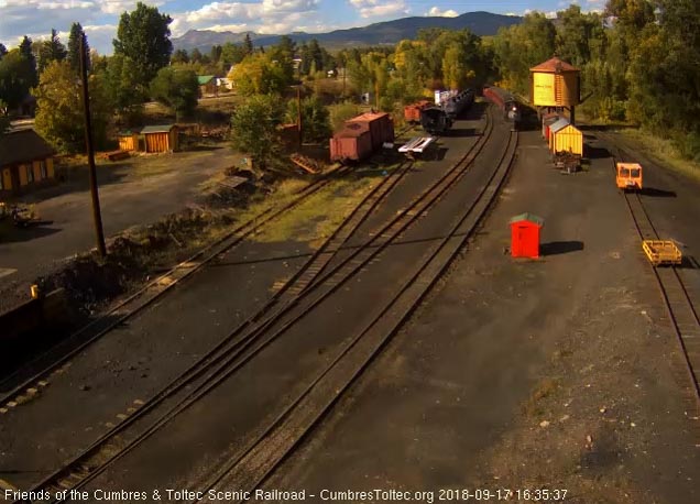 2018-09-17 The 487 is passing the tank as its 8 car train isn't quite in Chama yard yet.jpg
