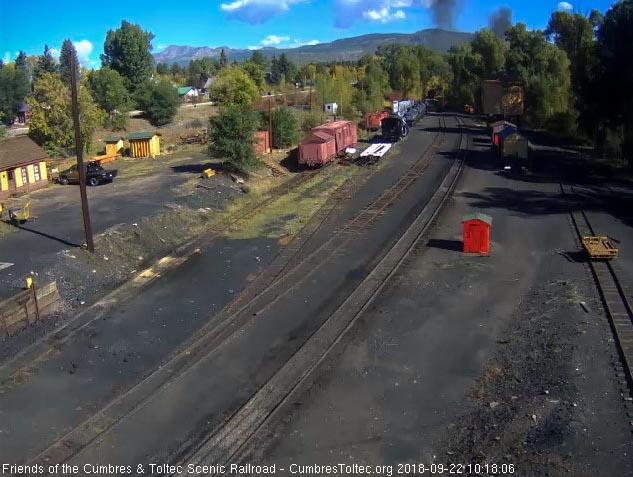 2018-09-22 The last cars are into the curve as this long train heads east.jpg