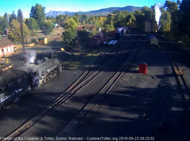 2018-09-23 The hostlers empty a bucket full of coal into the 489's bunker as 484 is at the tank with its high pressure pop going off.jpg