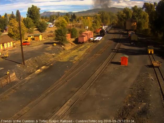 2018-09-25 The smoke is hanging heavy this morning as the last cars round the curve.jpg