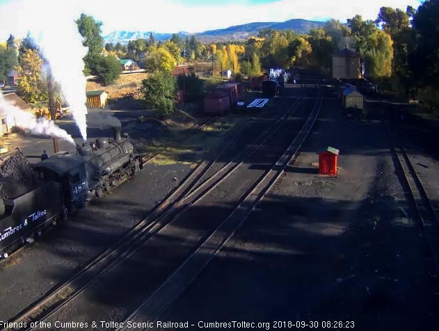 2018-09-30 The hostlers are adding coal to the bunker of 487 while 484 is getting water at the tank.jpg