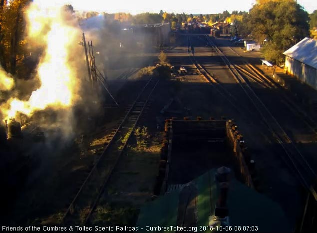 2018-10-06 The second locomotive's headlight is visible through the blown ash.jpg