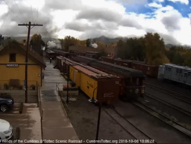 2018-10-08 After giving the high ball via radio, the conductor climbs on the parlor car.jpg