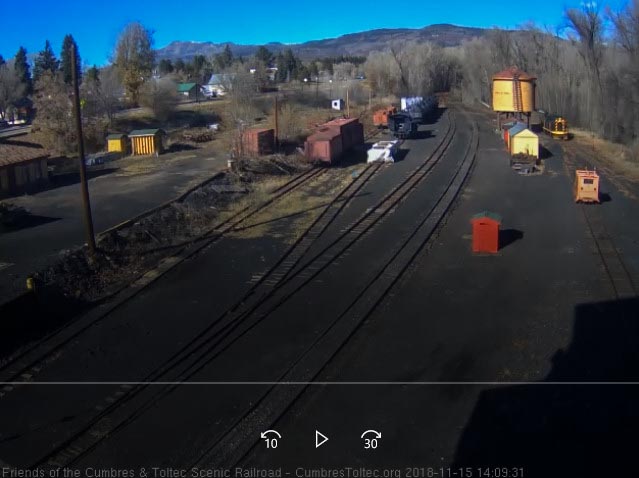 2018-11-15 On its way back from south yard, the 15 stops so one of the crew can pull down the spout on the tank.jpg