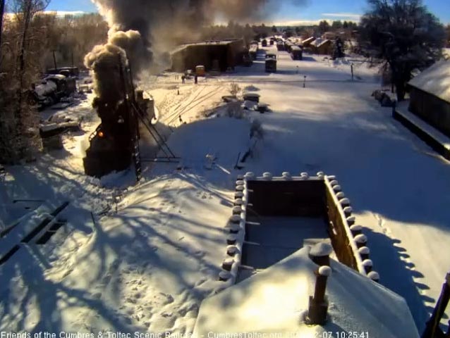 2018-12-07 The 487 has snow on the plow as it moves toward the pit.jpg