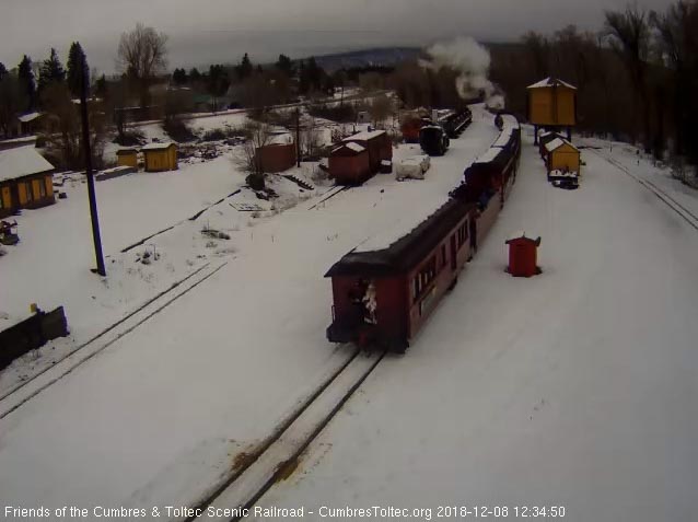 2018-12-08 Santa is riding the back platform on the cafe car as it backs into Chama.jpg