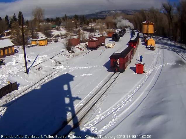 2018-12-09 The sun is back shining as train 1 backs into Chama with Santa on the back waving.jpg