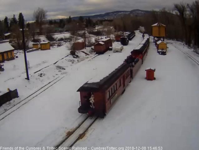 2018-12-08 As the forth train backs into Chama, Santa is at his post on the back platform.jpg