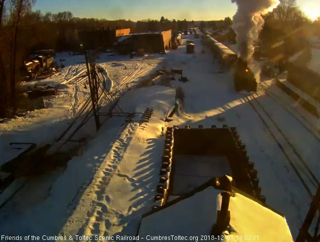 2018-12-09 The low sun shines on the smoke plume of the 487 as it gets the 5th train underway.jpg