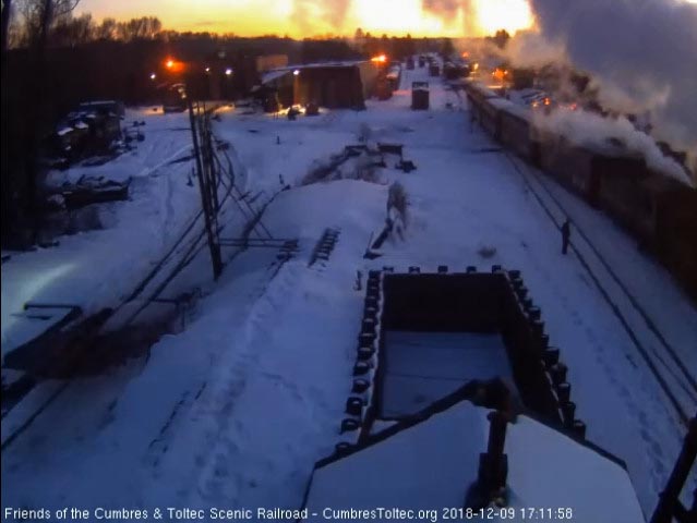 2018-12-09 The passengers off, the crew takes the 3 flat roof coaches and 2 of the regular coaches and come out to put them on the depot house track.jpg