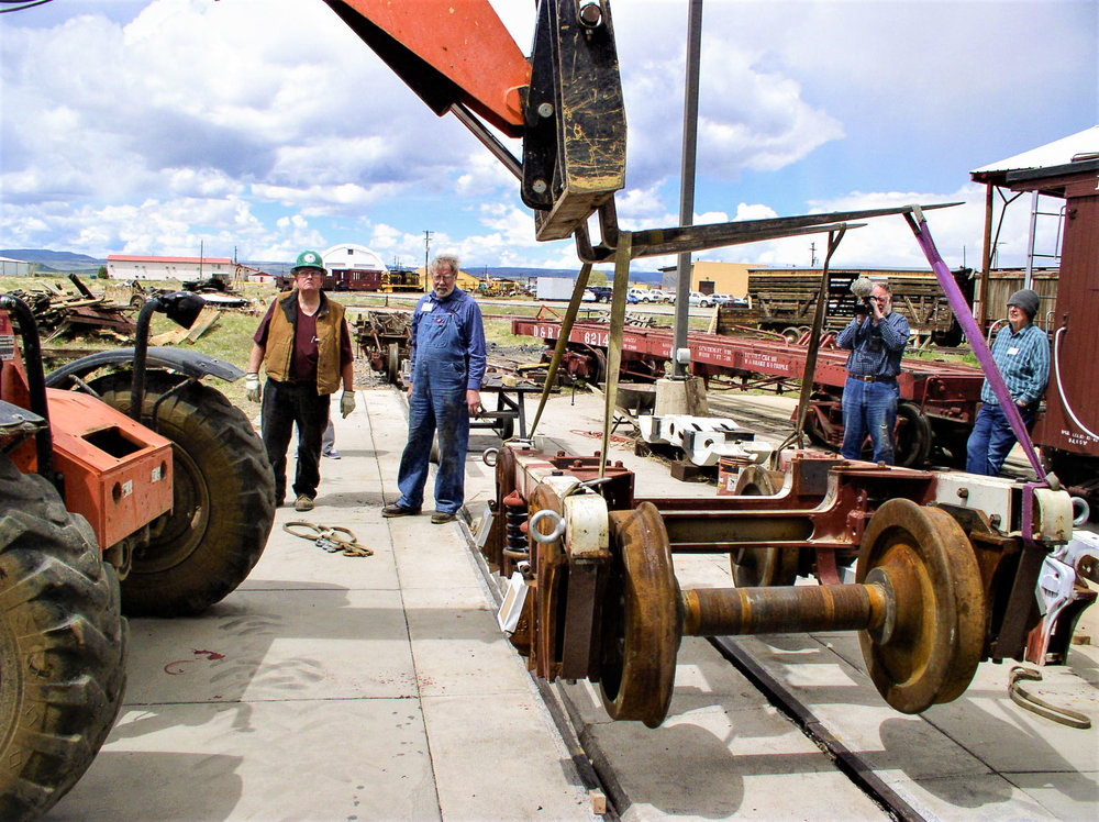 Fork lift picking up the finished passenger car truck.jpg