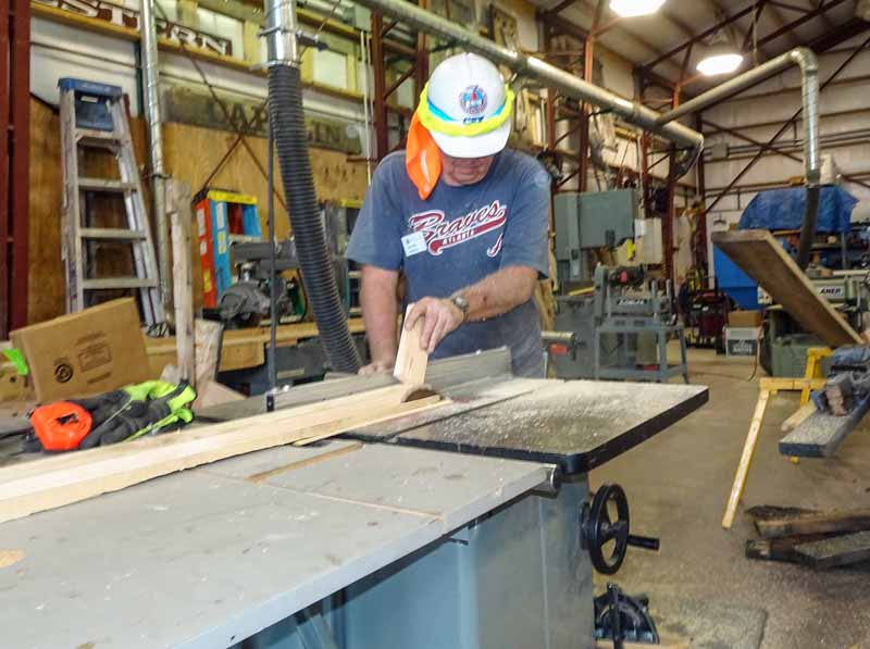 2019.07.31 Inside the CRF getting wood cut to length (1 of 1).jpg