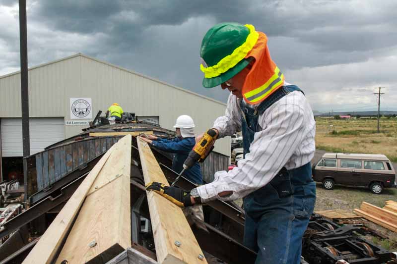 2019.08.01 Looks like a threatening sky over these guys attaching the boards (1 of 1).jpg