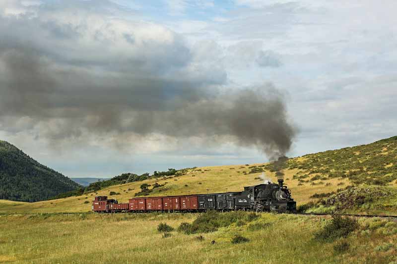 2019.08.11 The sun hits the train as it comes up to second crossing (1 of 1).jpg