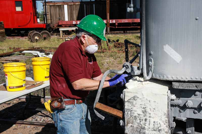 2019.08.24 Removing old paint from the end sill beam of the OY tender (1 of 1).jpg