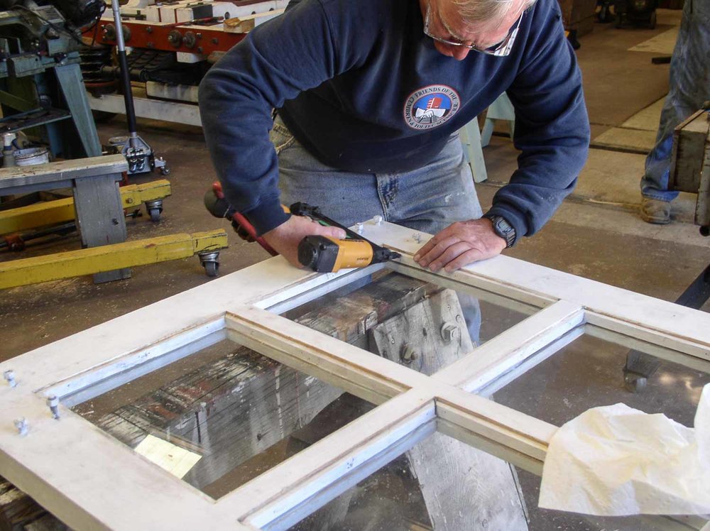 2019.09.25 oy Using a nail gun to put the framing back into the OY door (1 of 1).jpg