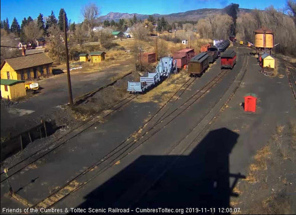 2019.11.11 The train is headed into the curve at the north end of the yard as the speeders follow (1 of 1).jpg