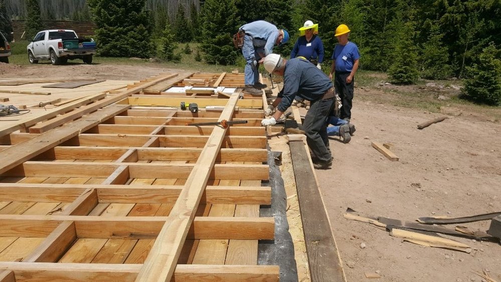 14 The crew works on the main floor with the subfloor seen below.jpg