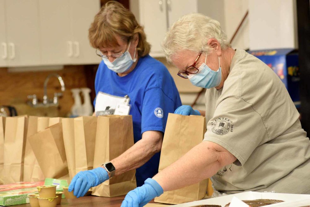 The lunch crew at the CRF fills up the bags to be handed out (1 of 1).jpg