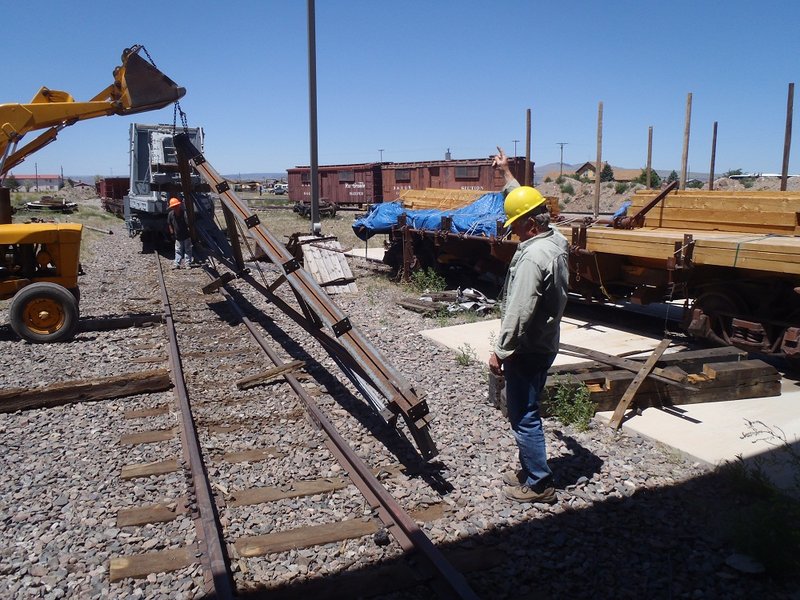 Russ Hanscom directs turning of truss to weld opposite side.jpg