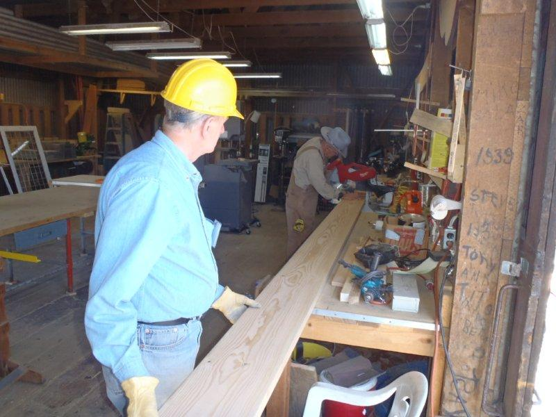 Larry McDonald and Team Leader Jim Hickman cut lumber for a new sign.png