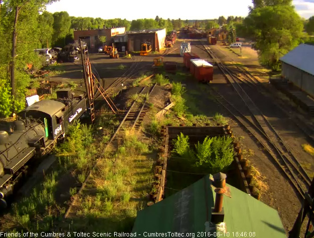 6.10.16 484 now gets the fire cleaned as the late day sun glints off the locomotive.jpg