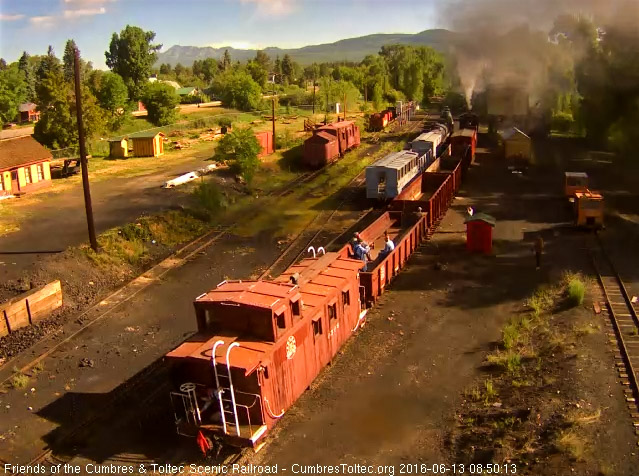 6.13.16 The student freight passes the coaling tower with happy students.jpg