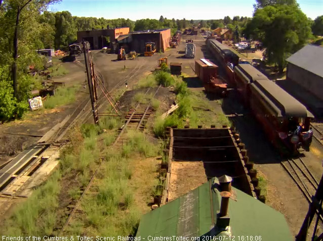 7.12.16 The trainman and car host occupy the platform of the Colorado.jpg