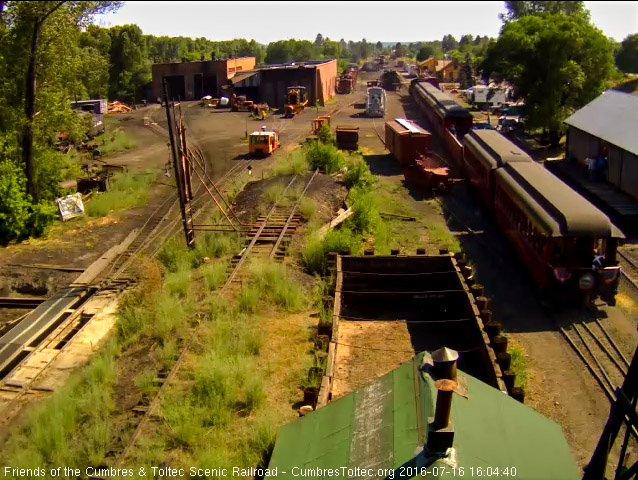 7.16.16 As the Colorado passes the coaling tower we see the car host on the platform.jpg