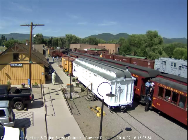 7.16.16 The trainman has dropped off and is getting the step box for passengers to detrain.jpg